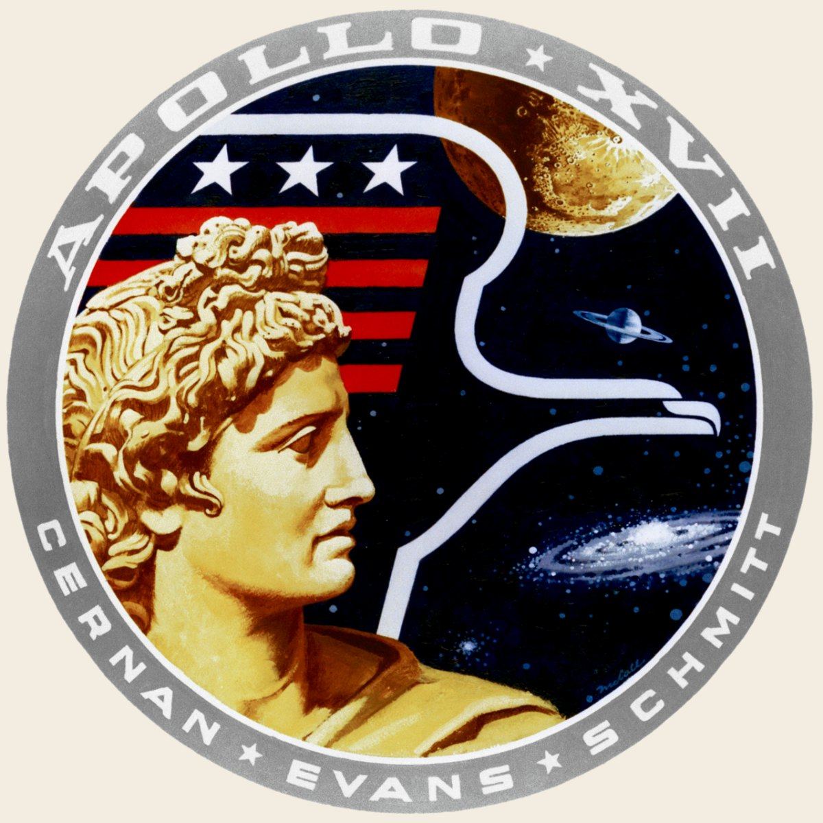 The Apollo 17 mission patch: the profile of the god Apollo beside an eagle, with the Moon, Saturn and a galaxy behind